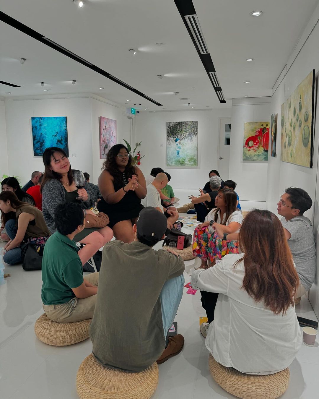 A group of participants play the card game Fiero! at the launch event in Singapore (Photo: Vincent Siu and The Zall Bookstore/Instagram)