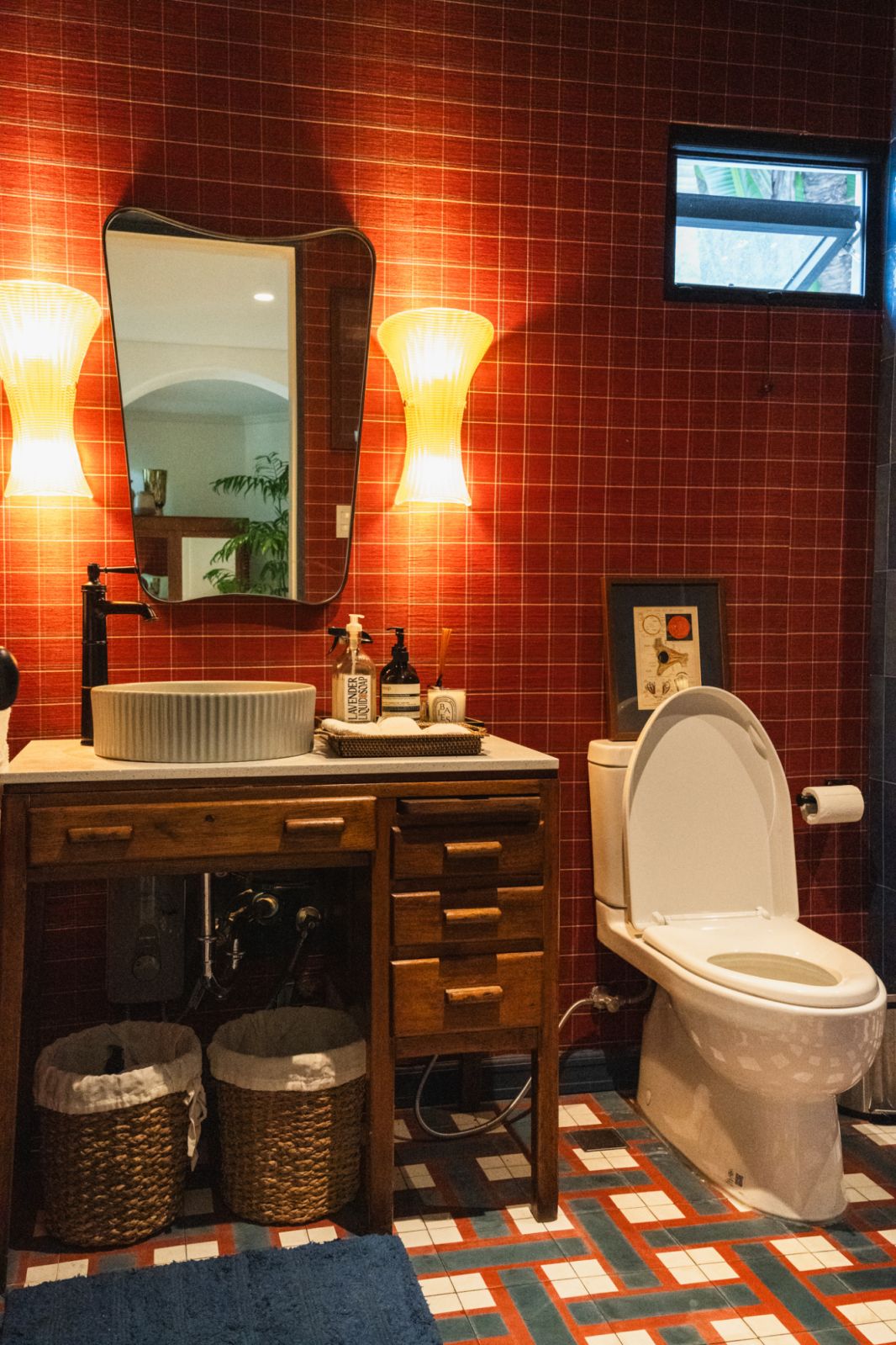 The powder room, with tiles that represent the couple's alma maters, Georgetown and Cornell