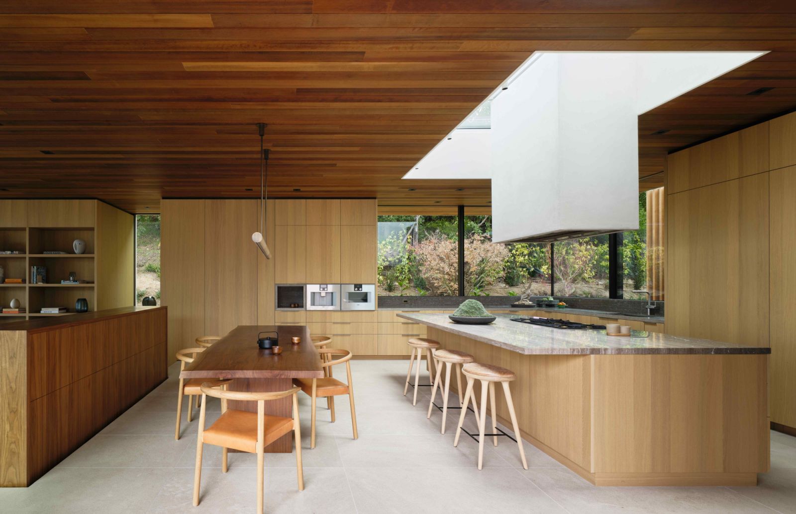 The expansive kitchen area with warmer wood tones