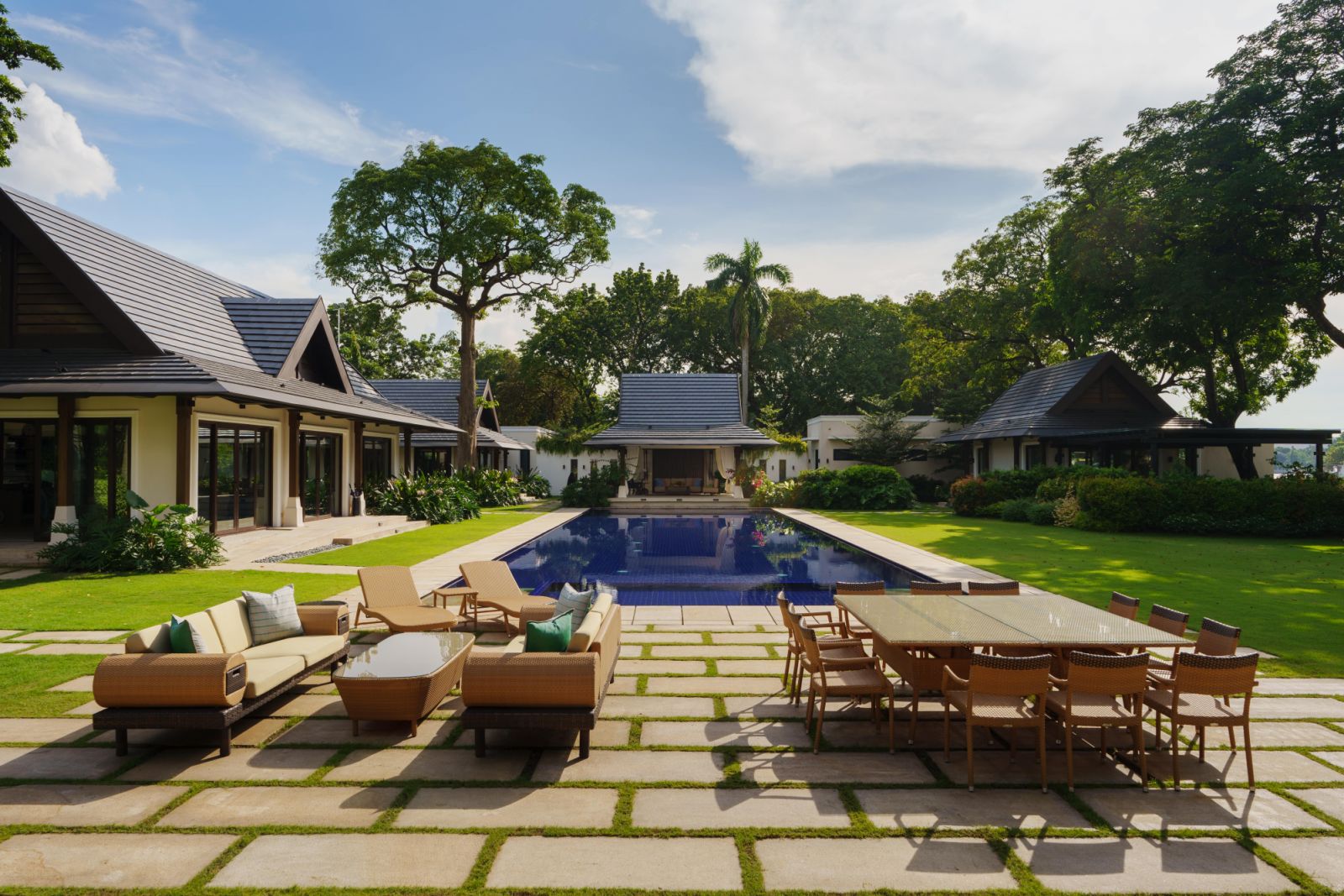A view of the pool and smaller villa-style buildings within the grounds (Photo by Ian Santos)