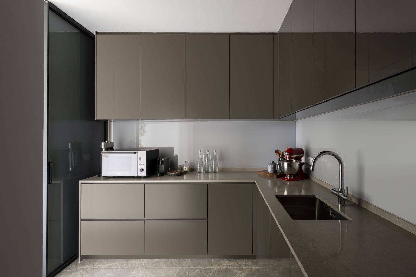 The minimalist design includes high-end appliances and a spacious countertop, perfect for the executive chef homeowner's culinary pursuits