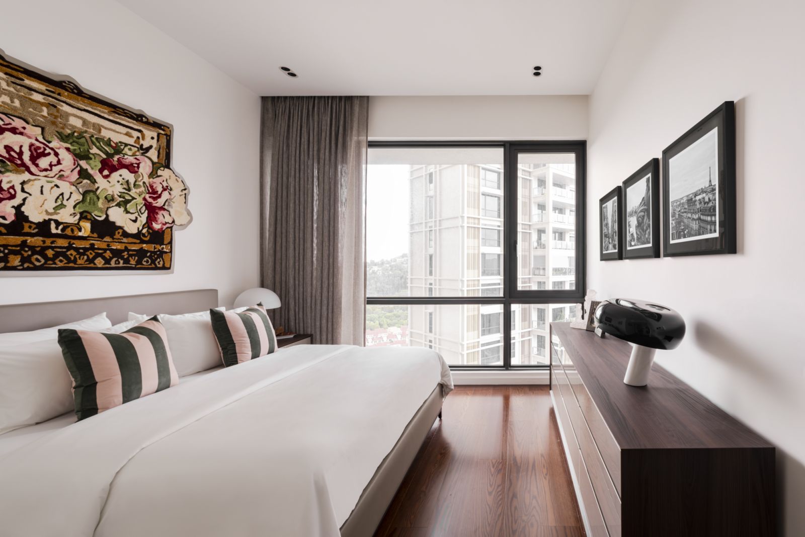 The master bedroom epitomises luxury condo living with floor-to-ceiling windows offering panoramic Kuala Lumpur views.