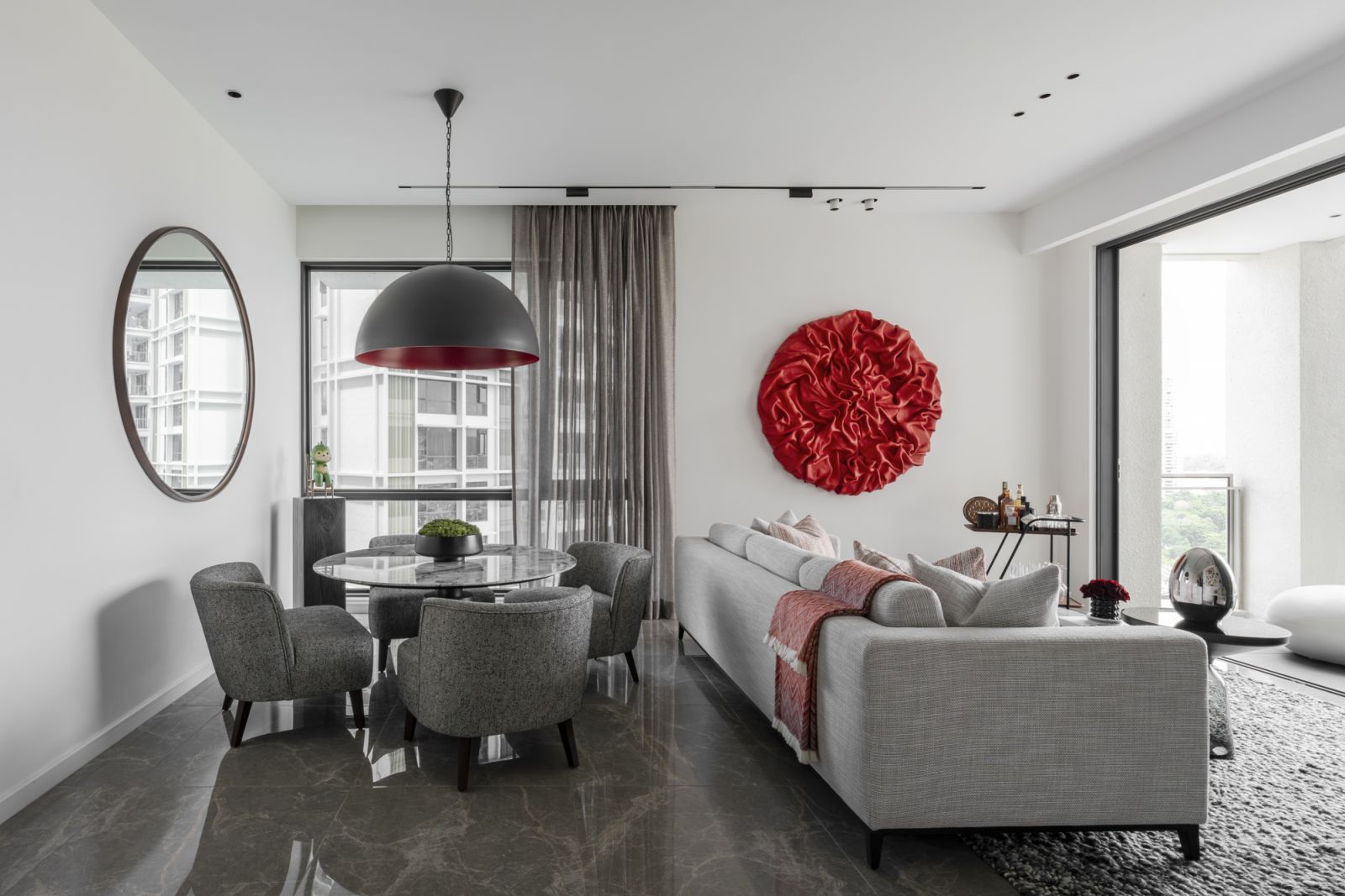 The dining area features a lower 650mm table height, allowing for seamless transitions between dining and lounging