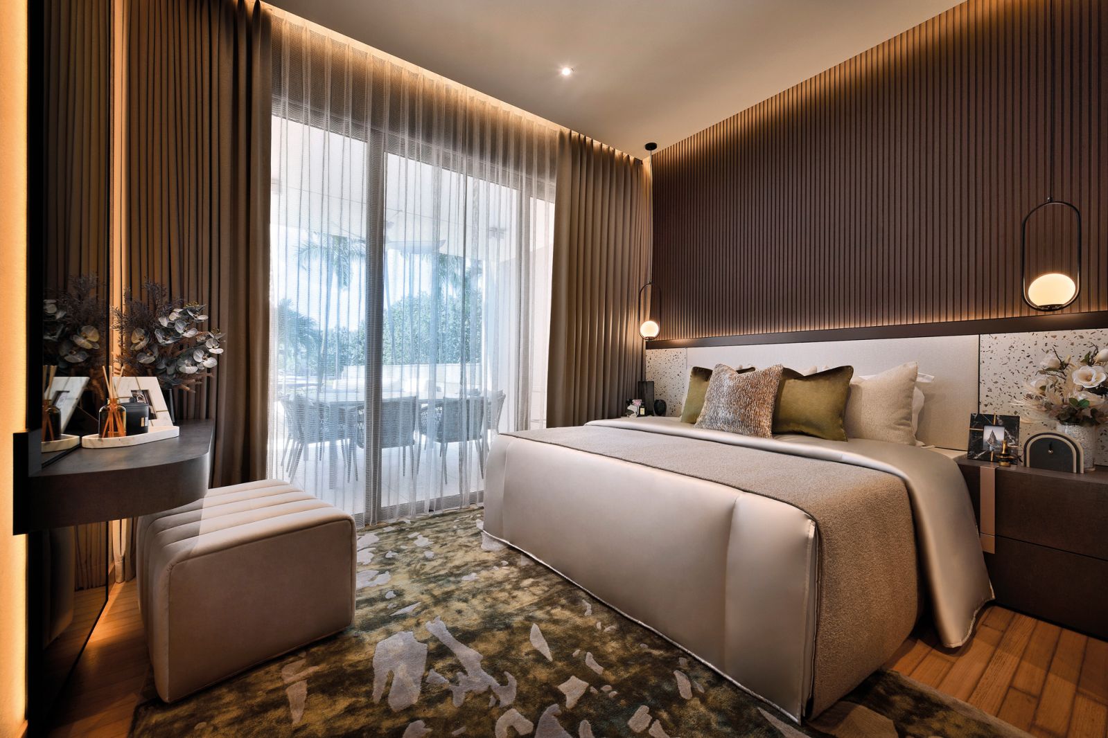 The earthy material palette is also evident in the ground-floor unit’s master bedroom