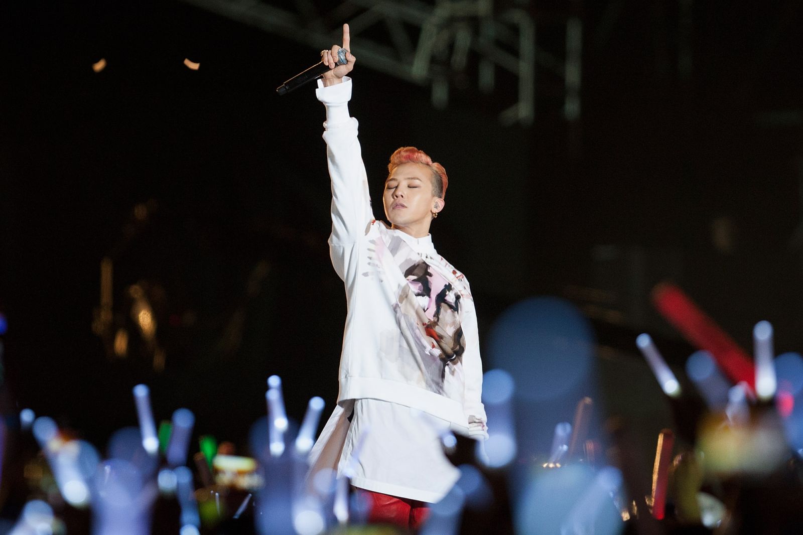 SEOUL, SOUTH KOREA - APRIL 13:  G-Dragon of South Korean boy band Bigbang performs onstage during singer Psy 'Happening' concert at Seoul World Cup Stadium on April 13, 2013 in Seoul, South Korea.  (Photo by Han Myung-Gu/WireImage)