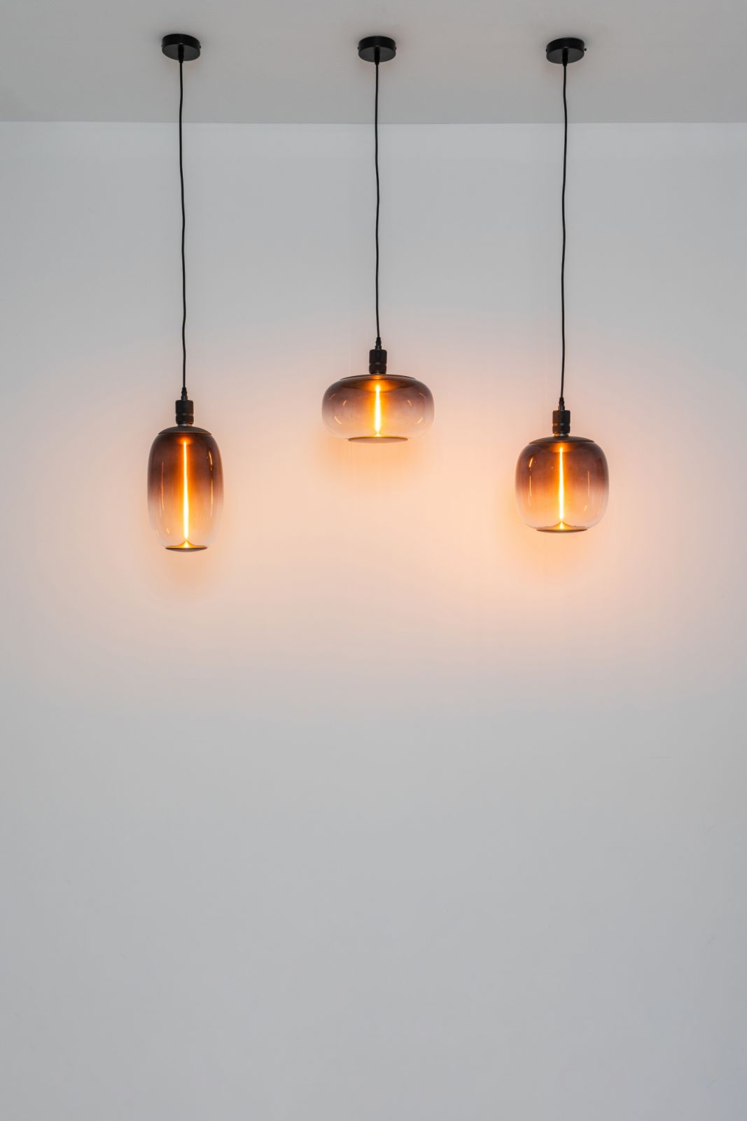 Equally warm and visually pleasing are the Magnetite pendant lights