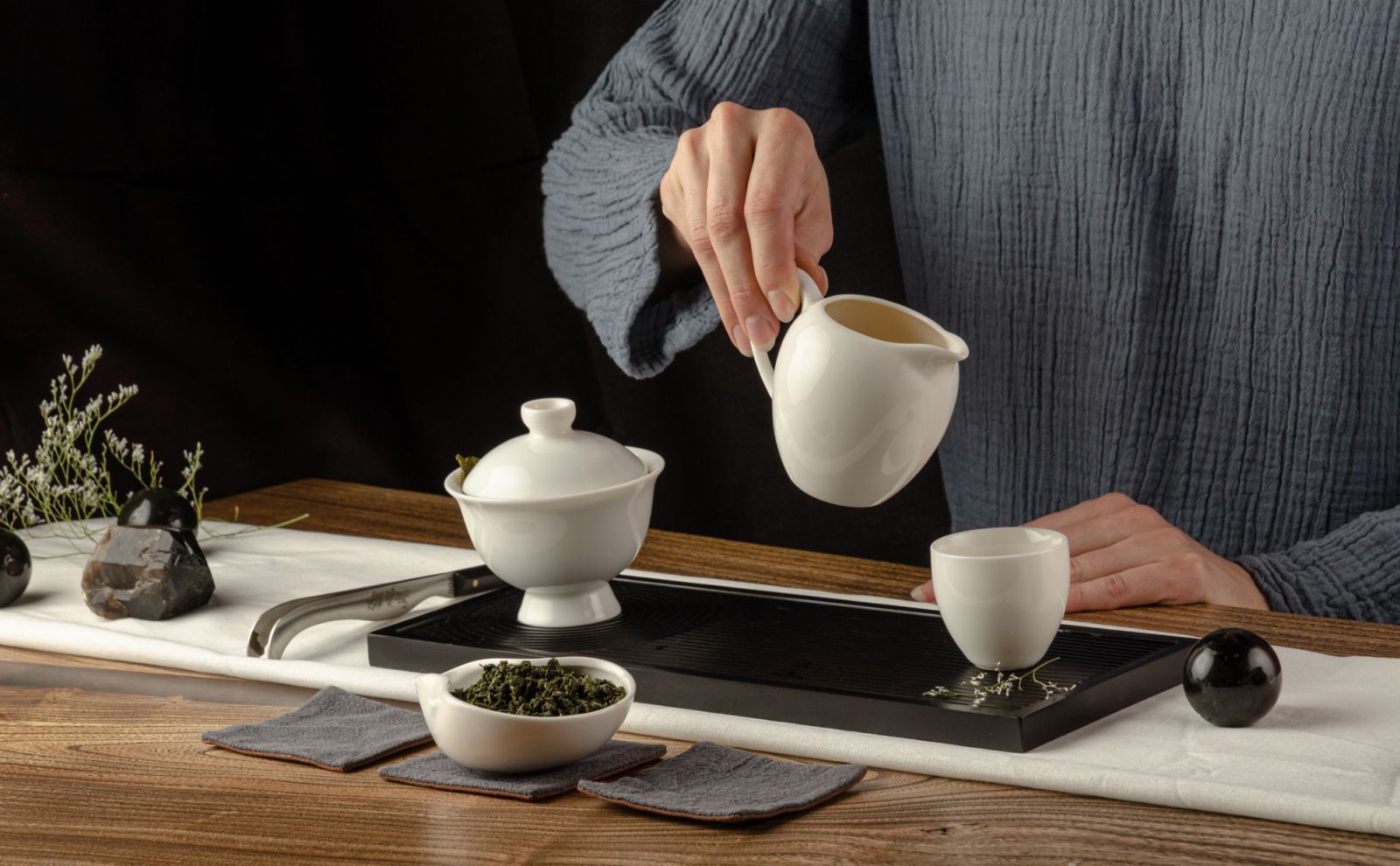the tea table with instruments teapots cups pancake and tea Shen Puer
