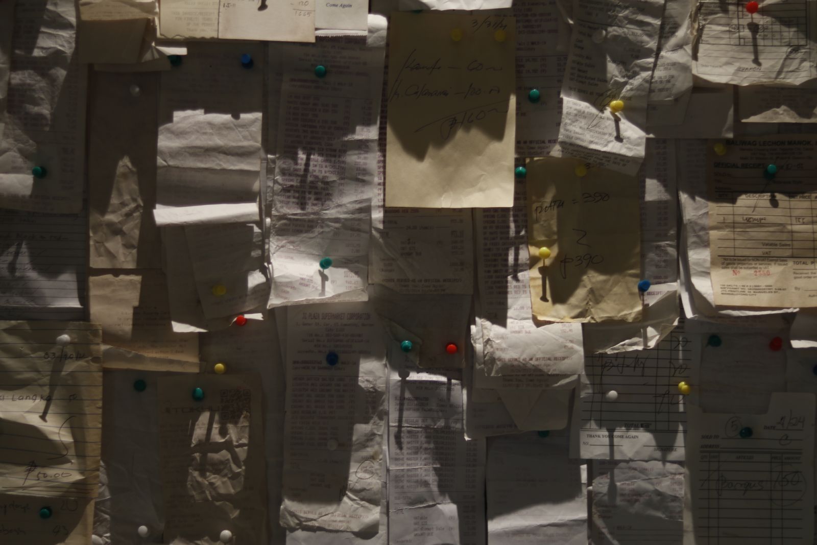 A wall of old receipts and shopping lists (Photo: Calle Wright)