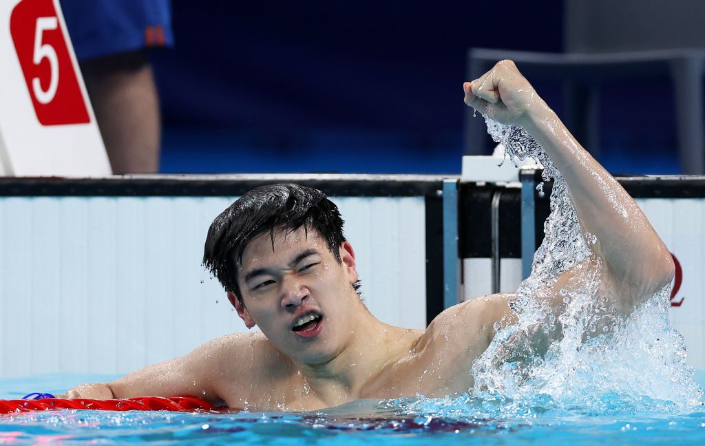 Pan Zhanle celebrates after winning gold in a world record time in the men's 100m freestyle final on day five of the Olympic Games Paris 2024 at Paris La Defense Arena on July 31, 2024 in Nanterre, France. (Photo by Quinn Rooney/Getty Images)