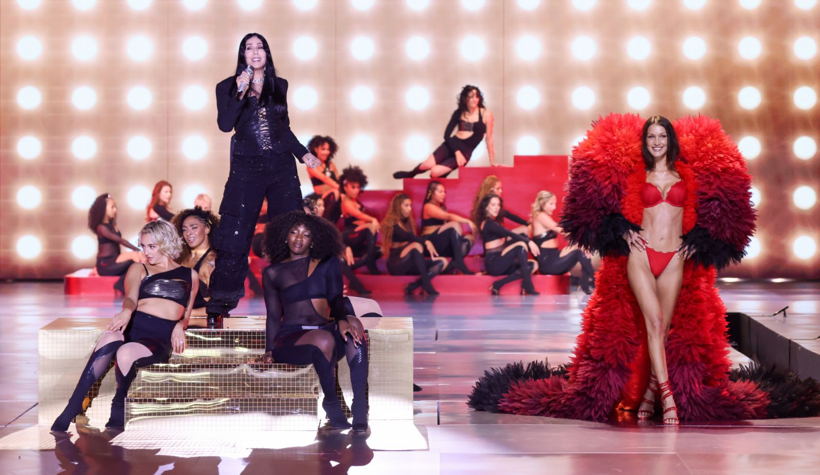 Cher and Bella Hadid on the runway at the Victoria's Secret Fashion Show held at the Brooklyn Navy Yard on October 15, 2024 in New York, New York. (Photo by Masato Onoda/WWD via Getty Images)
