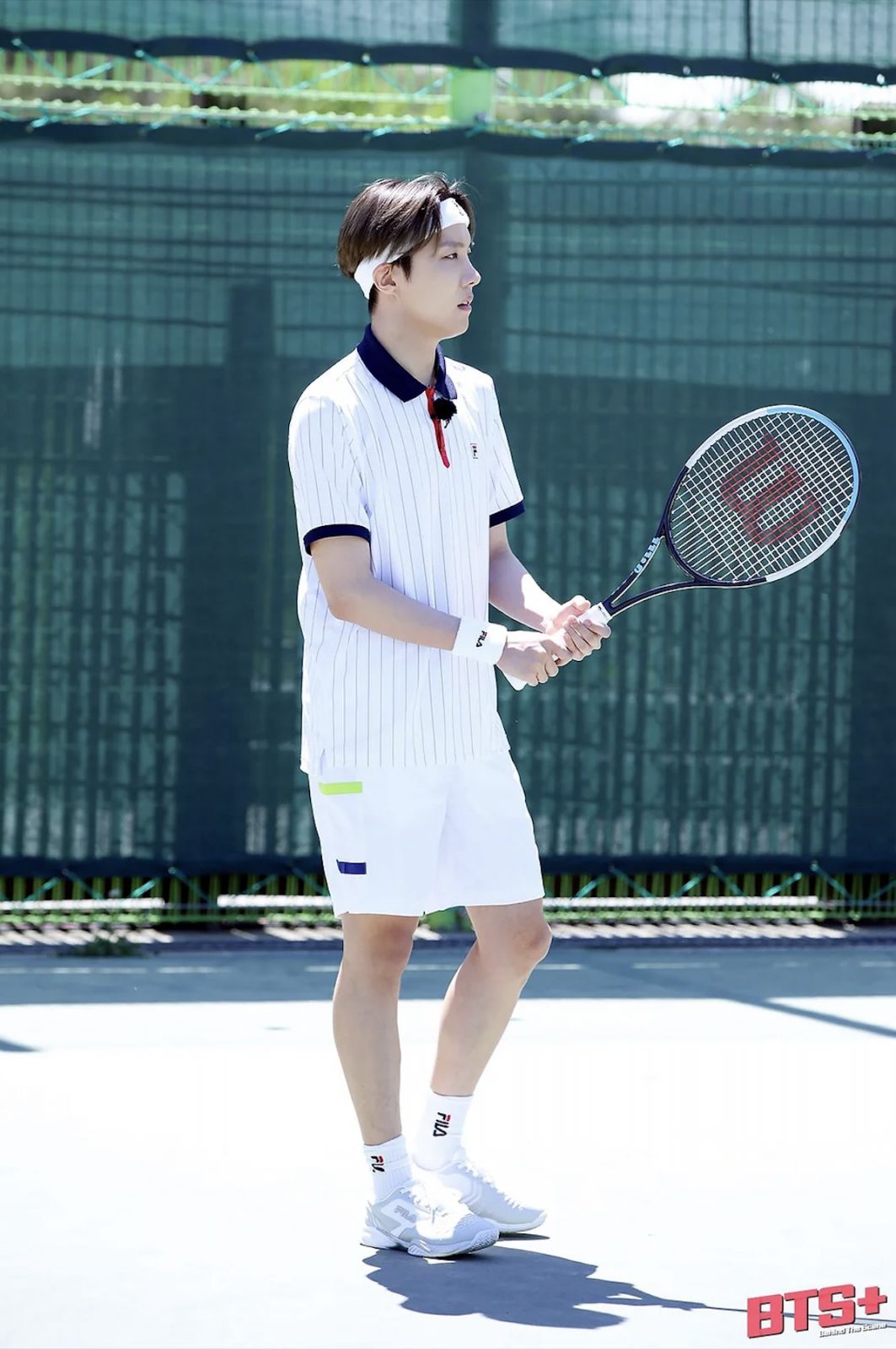 j-hope playing tennis for a Run BTS variety show episode (Photo: Weverse)