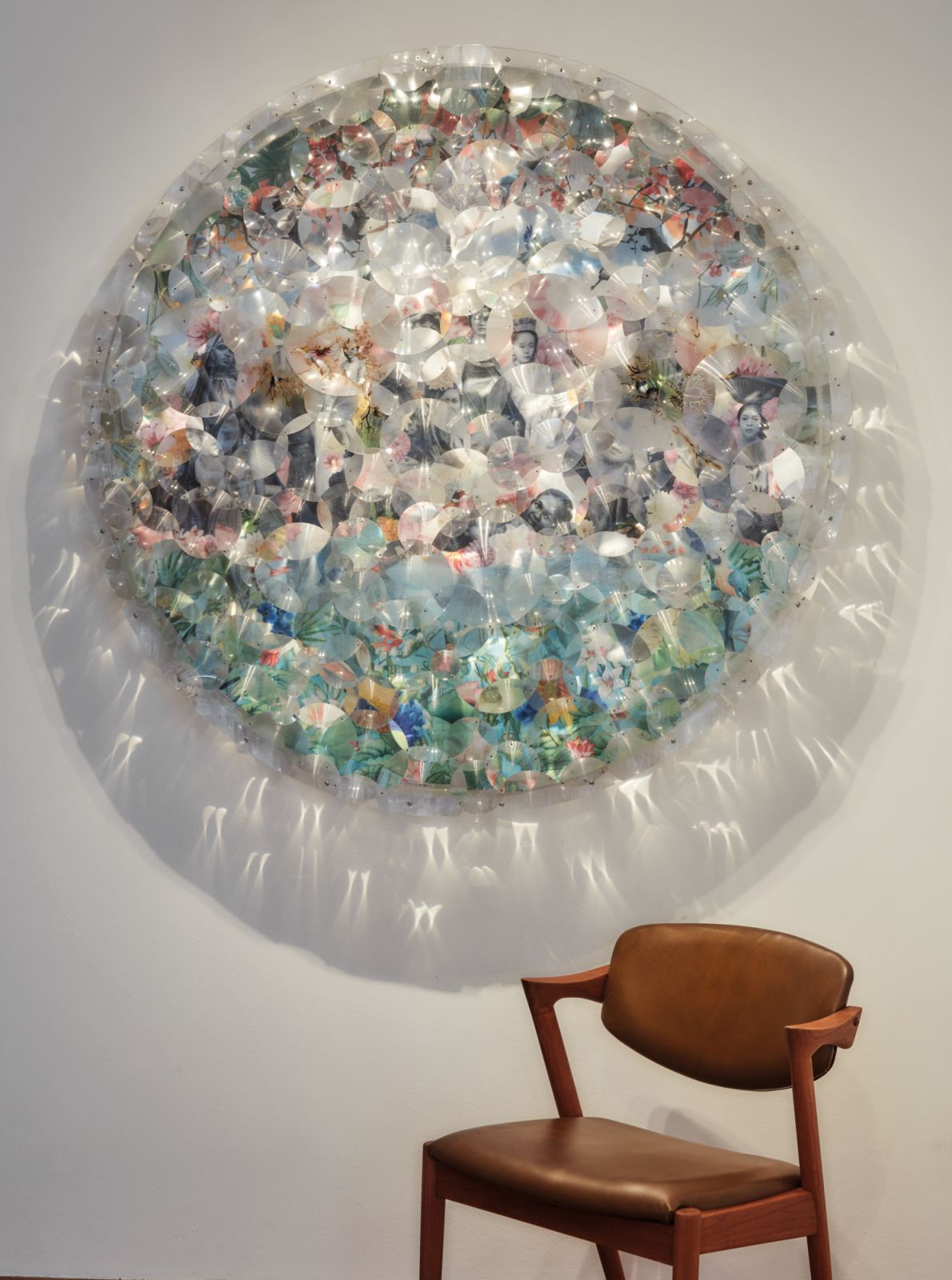 A work by Suzann Victor, represented by Gajah Gallery, above a vintage Kai Kristiansen chair near the entrance