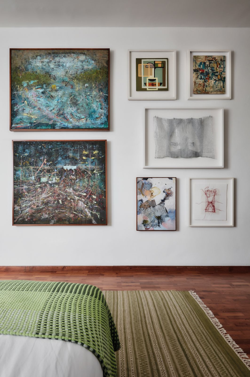 A view of the bedroom and its thoughtful displays of artworks