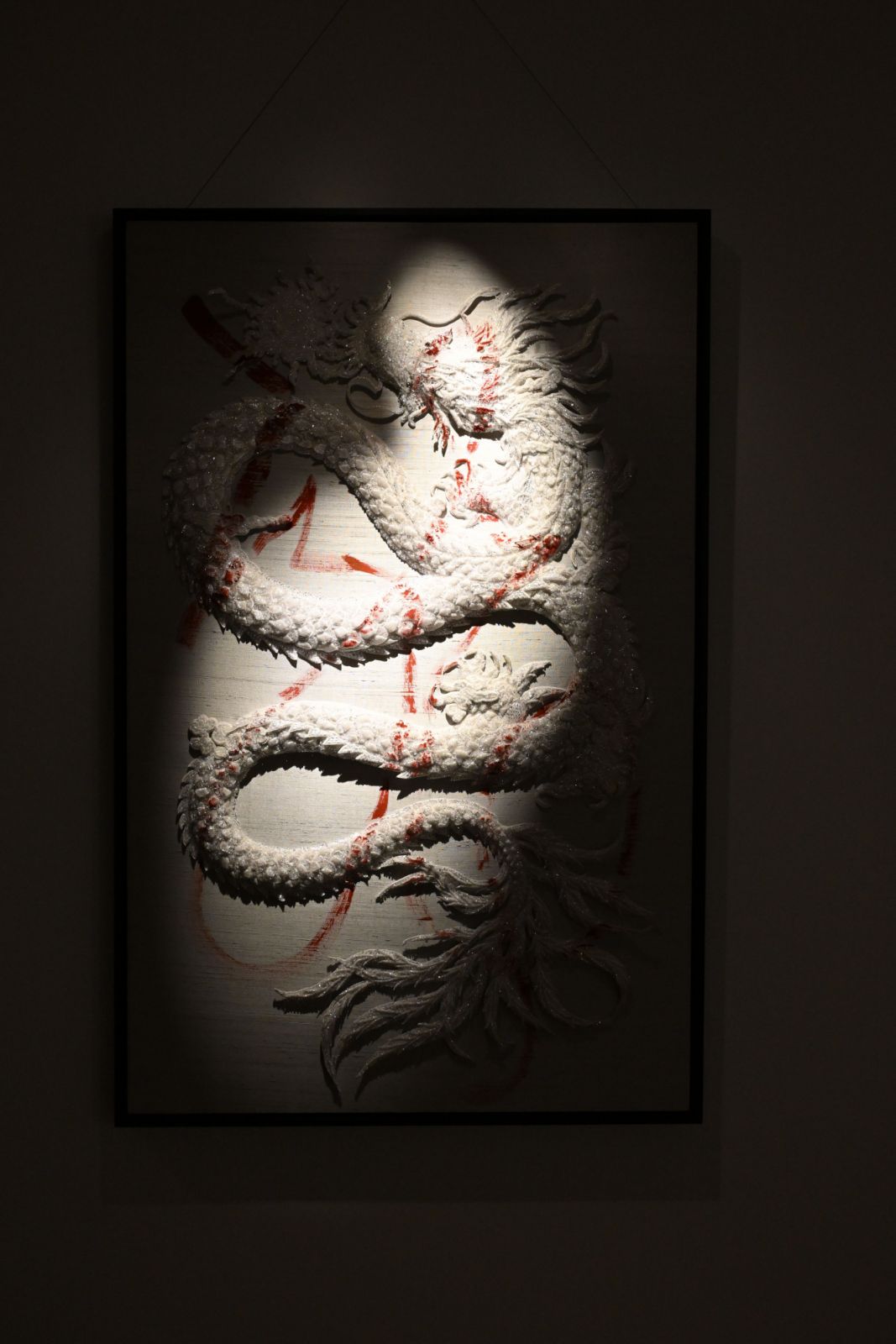 MYTH Evolution: Dragon is the Word: The calligraphy on the white jeweled dragon reads “lóng,” which means “dragon” in Chinese. During a trip to Macao, Bernard encountered a Taiwanese feng shui master who effortlessly wrote “lóng” on a piece of paper and handed it to him. This interaction inspired Bernard to use the dragon motif to tell his own story. In this piece, Bernard recreates the Chinese calligraphy of “lóng” upon the jeweled dragon—an act of boldness