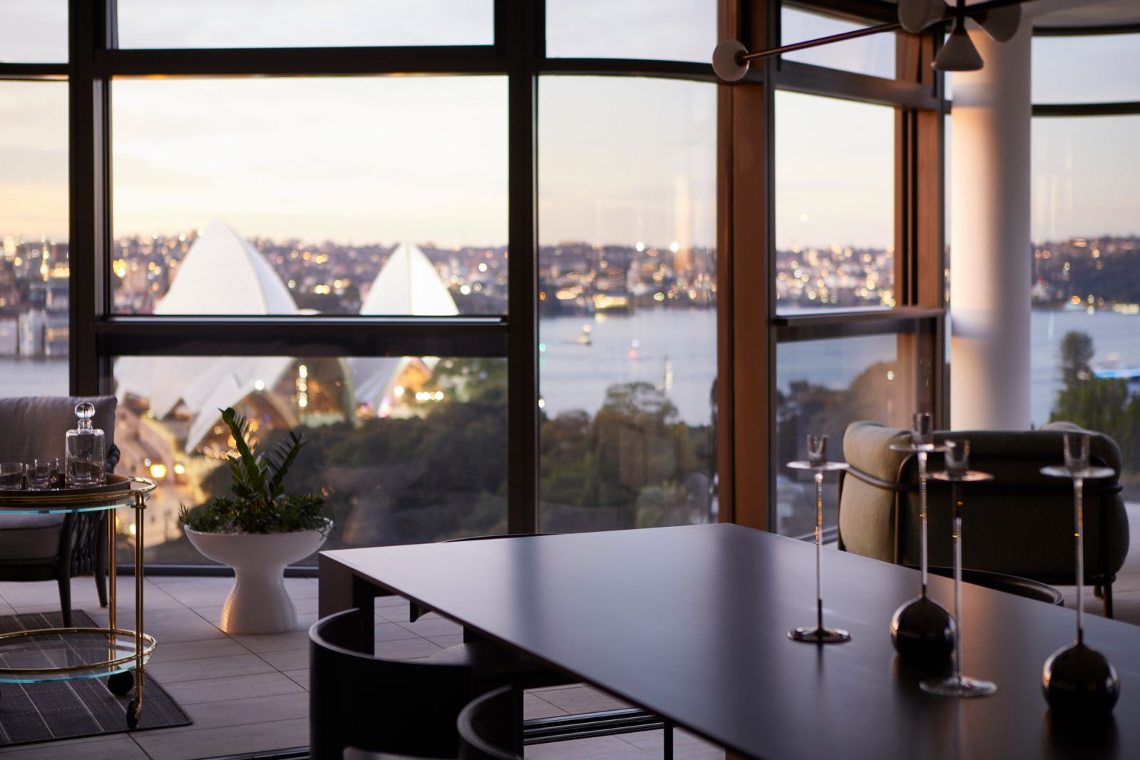 The dining area with views framing the Sydney Opera House