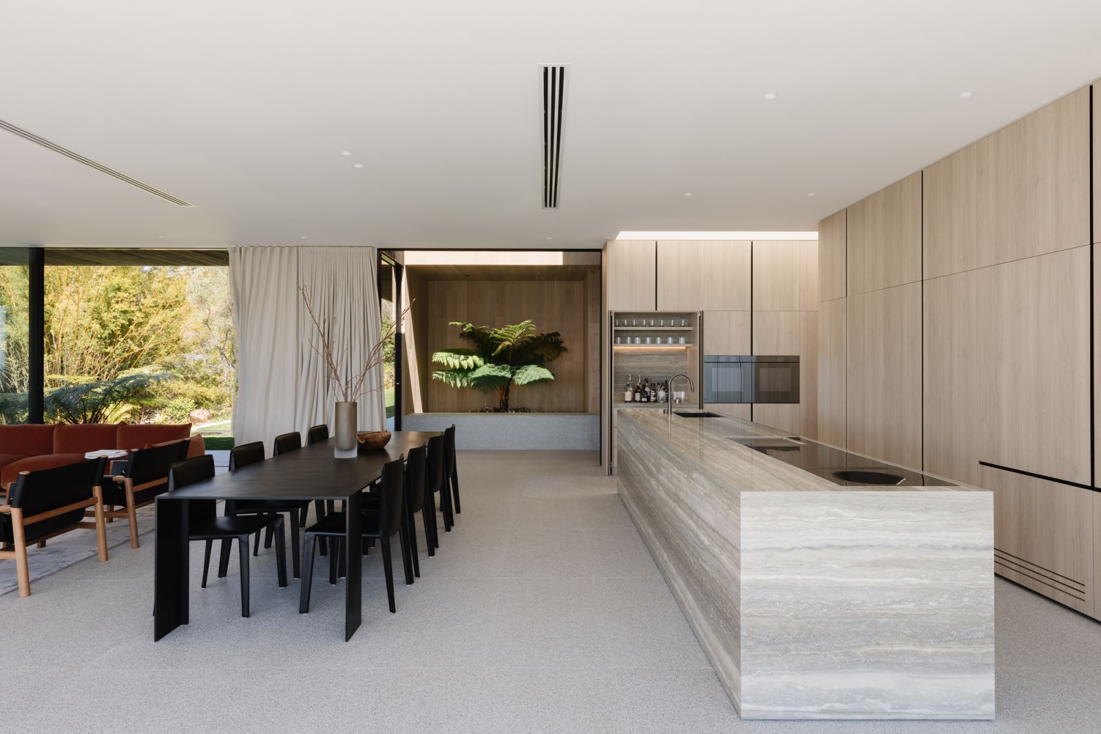 The Noosa home’s sleek kitchen and dining space