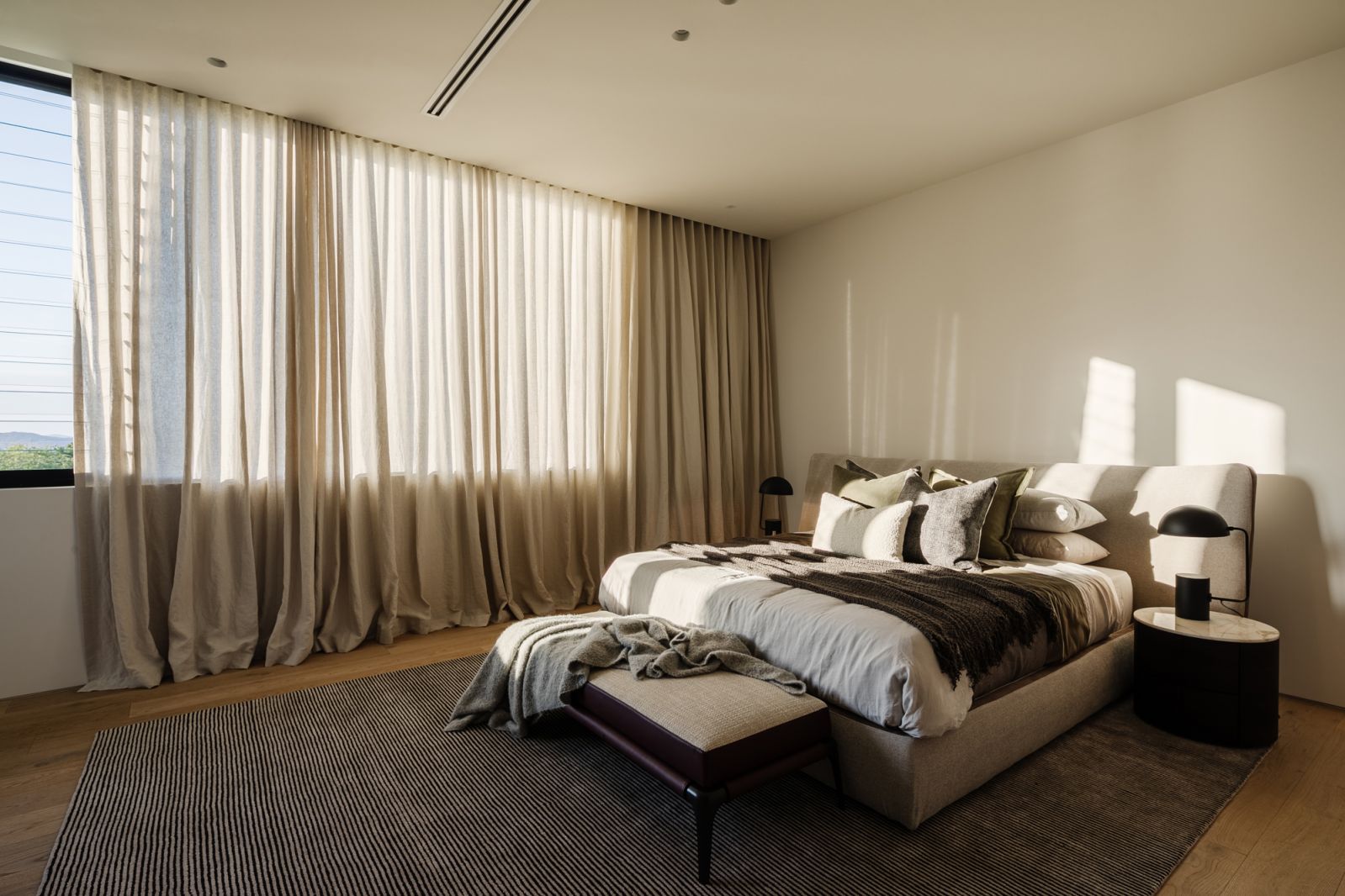 A sunlit bedroom bathed in a warm glow