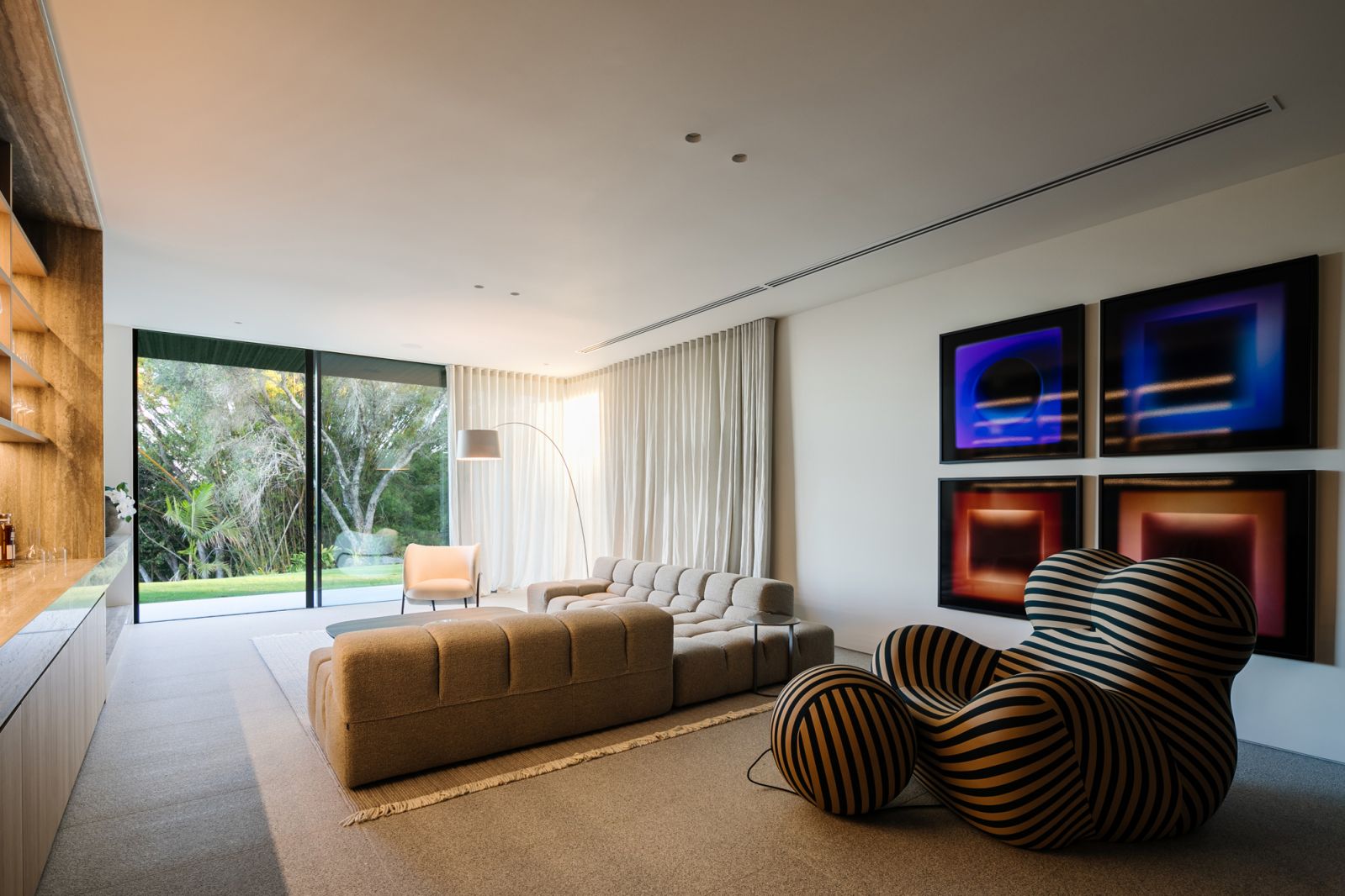 The games room is a key highlight of the Whipbird house in Noosa, featuring a playfully striped Series Up 2000 armchair and the Tufty-Time sofa from B&B Italia