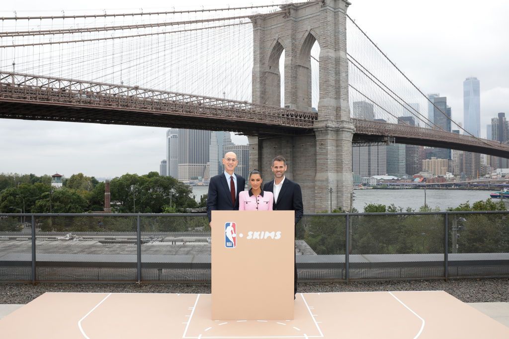 NEW YORK, NEW YORK - SEPTEMBER 28: (L-R) NBA Commissioner Adam Silver, Co-Founder & Creative Director of SKIMS Kim Kardashian and Co-Founder & CEO of SKIMS Jens Grede announce SKIMS being named the official underwear partner of the NBA, WNBA, and USA Basketball on September 28, 2023 in New York City. (Photo by Dimitrios Kambouris/WireImage for SKIMS)