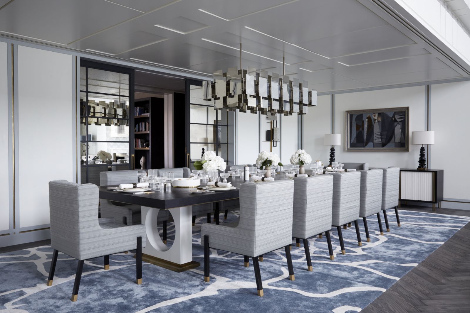 A soothing palette of dreamy blue, teal, and off-white in the formal dining area