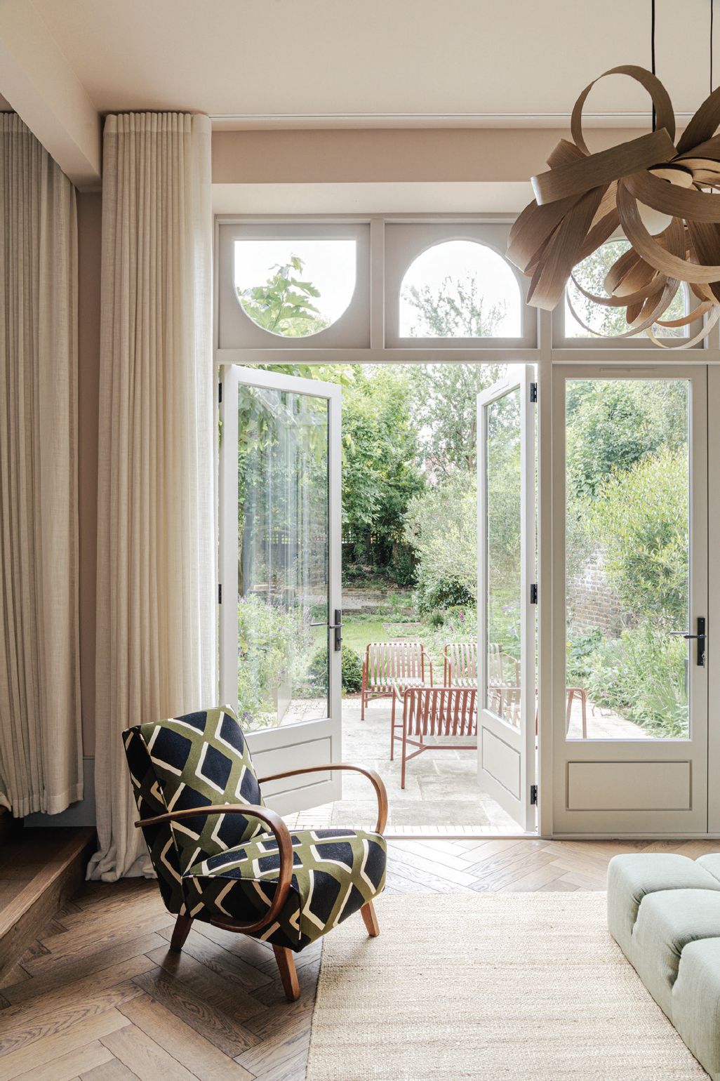 The patio doors with a view of the sprawling garden