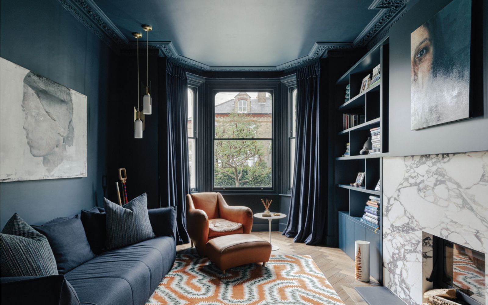 The snug, painted a deep shade of blue to create a cosy atmosphere