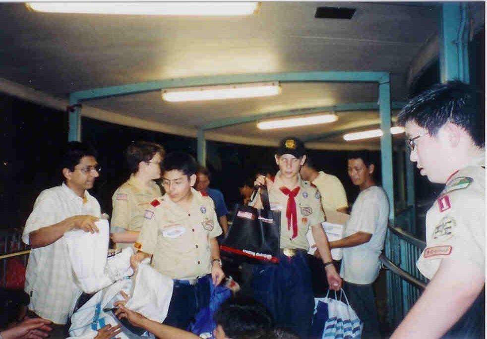 Young James gave out the hygiene kits he prepared with his friends to the homeless community in Hong Kong (Photo: James Thomson-Sakhrani)