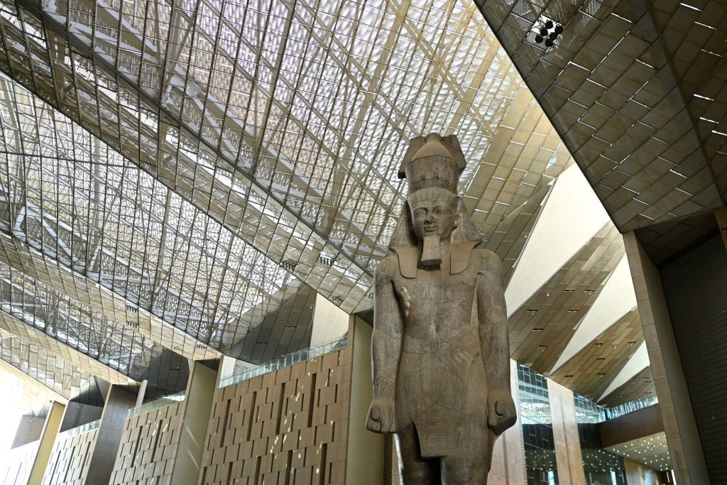 GIZA, EGYPT - OCTOBER 15: King Ramses II statue displayed at the Grand Egyptian Museum during the trial partial operation on October 15, 2024 in Giza, Egypt. With 872,000 square-feet of floorspace, the Grand Egyptian Museum is the largest archaeological museum in the world. (Photo by Sayed Hassan/Getty Images)