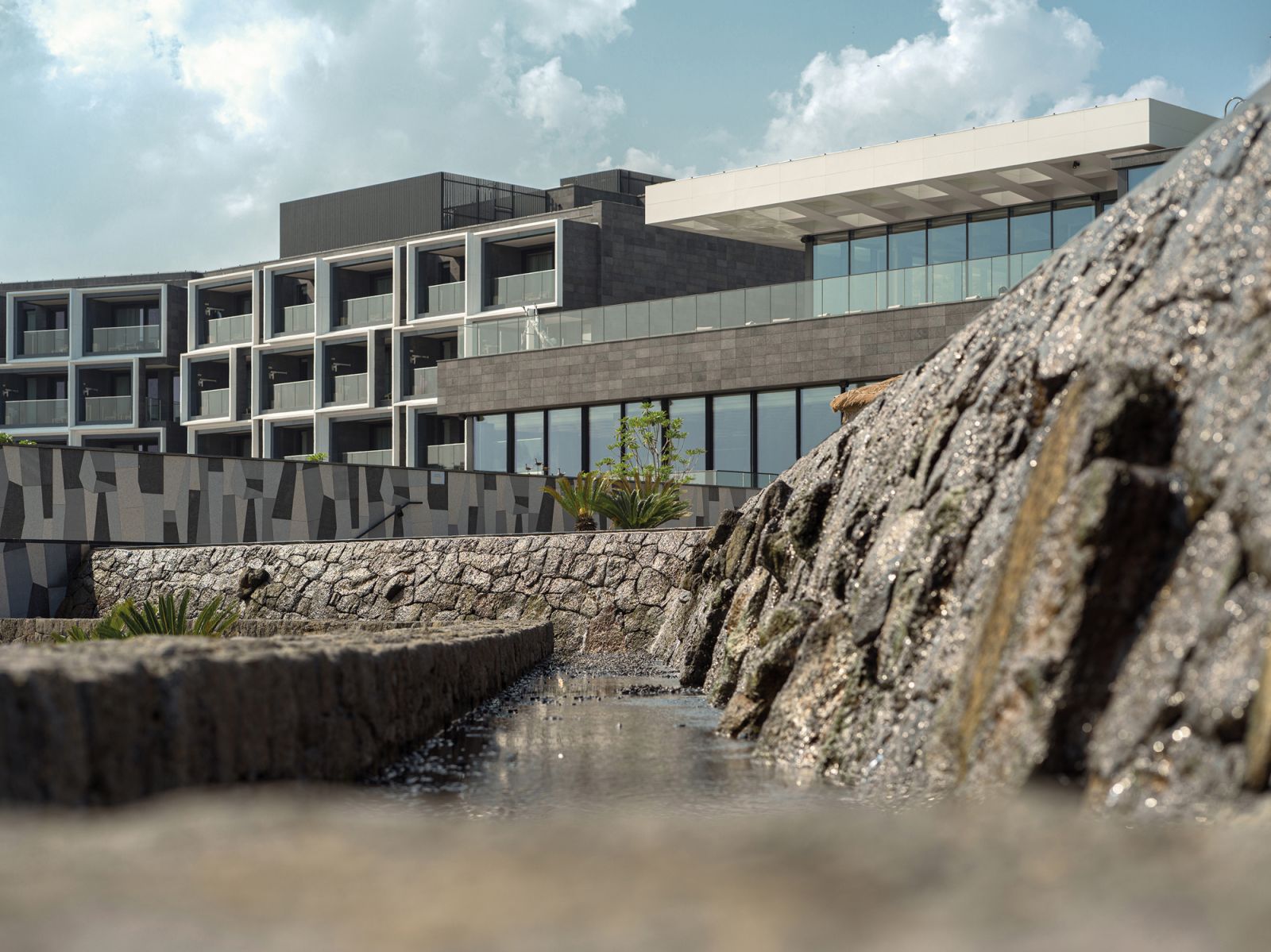The brutalist exterior of the JW Marriott Jeju Resort & Hotel by WATG and Bill Bensley (Photo: JW Marriott)