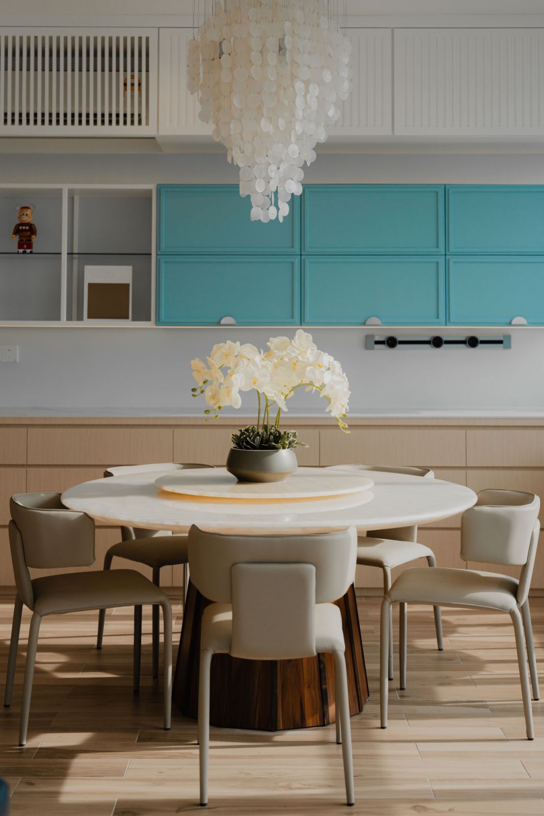 Natural light streams into the open dining and kitchen