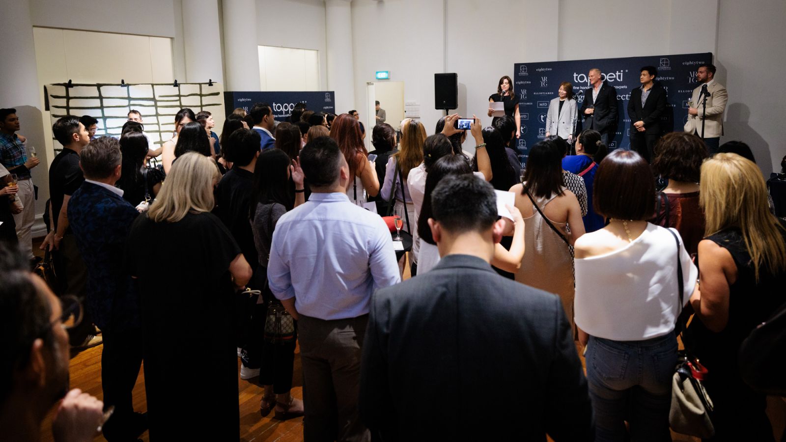 The audience taking in the introduction by Tappeti founder Karinna Gobbo