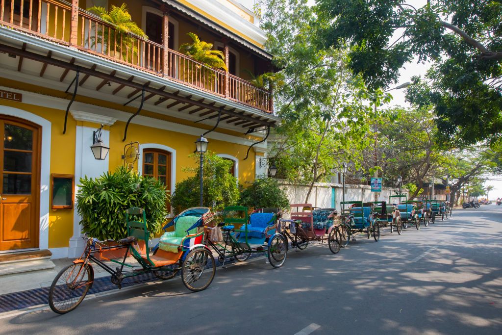 Bicycle rickshaws outside French colonial era Palais de Mahe boutique hotel in Puducherry, India (Photo: Getty Images)