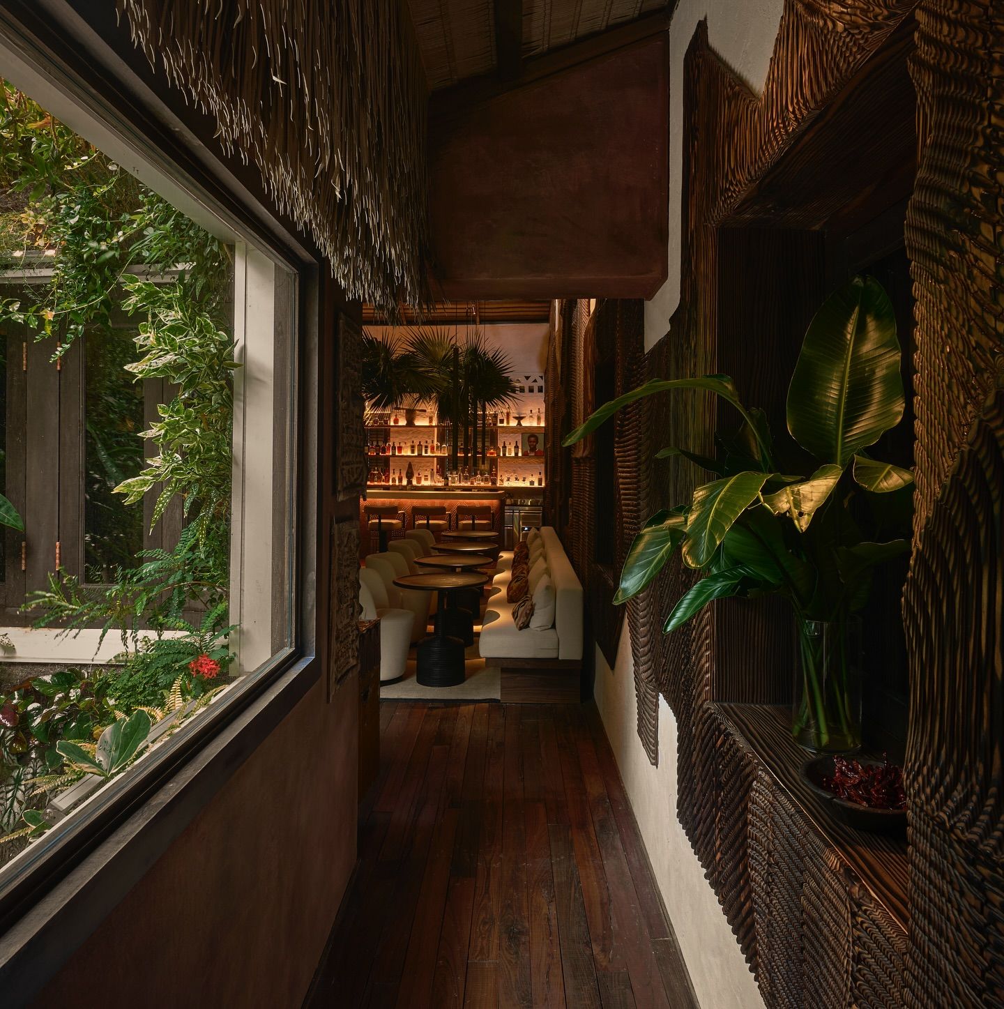 The corridor at Tamba takes you through the best view of its vertical garden by Patrick Blanc on one side, and the scorched wood panels by Etienne Moyat on the other (Photo: Facebook / Tamba)