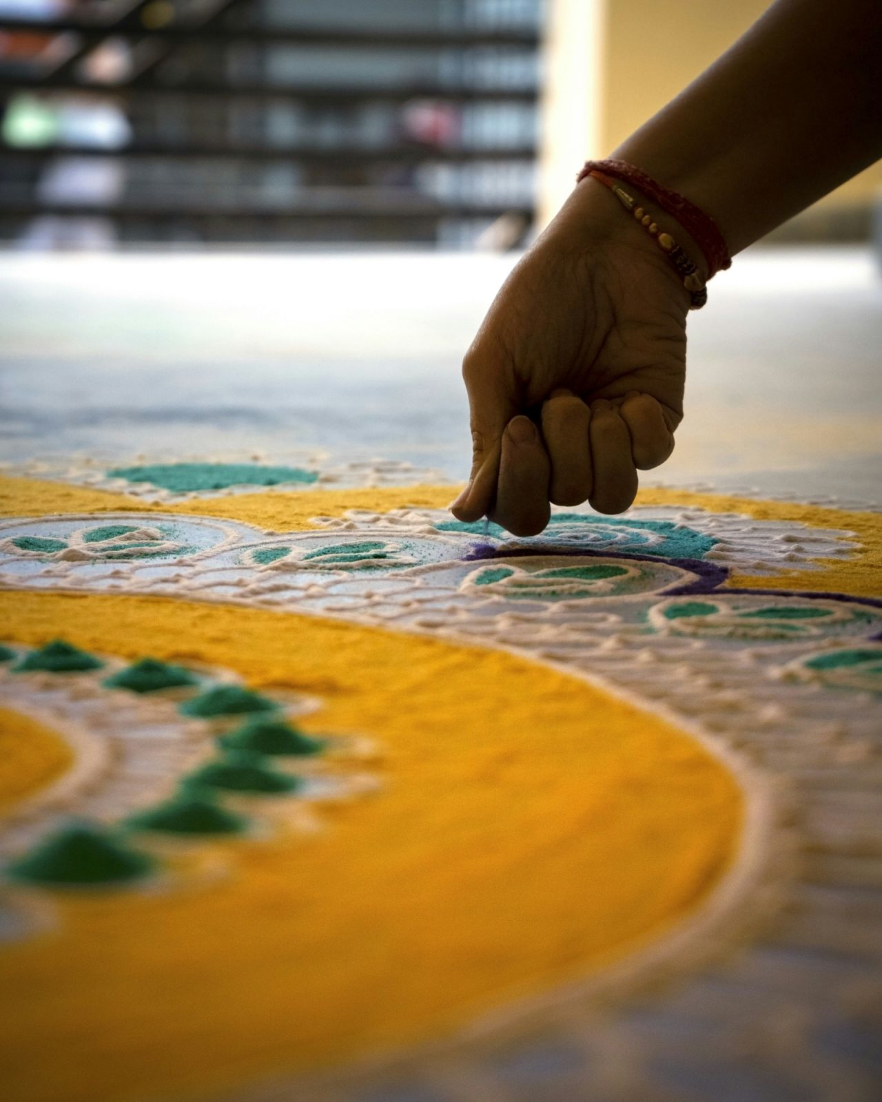 Traditional rangoli floor art done at the entrance of homes during Diwali to ward off evil and bring colour into the lives of the people (Photo: courtesy of Ashutosh Diwan / Unsplash)