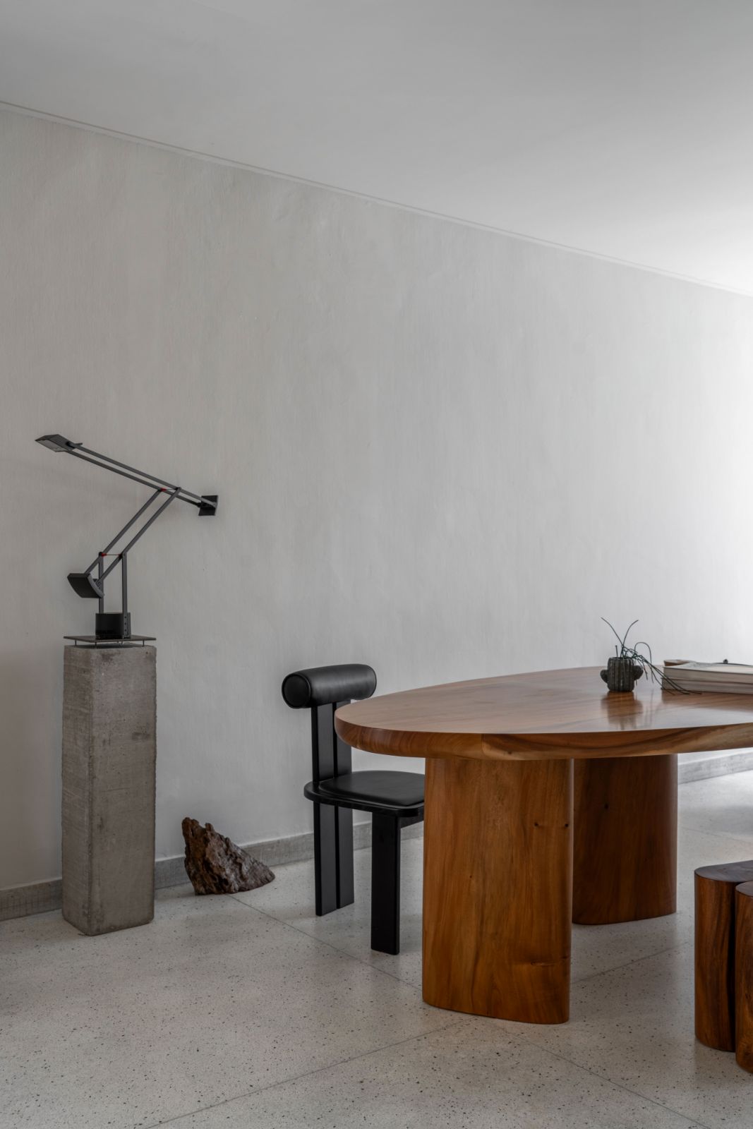 The large, custom-made solid wood table and mirrored armchairs were designed by the studio