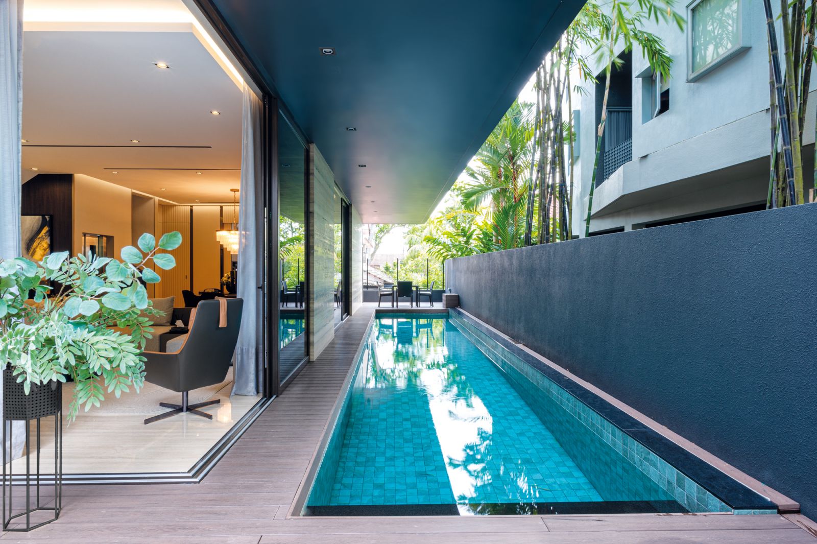 A lap pool lines the outside of the house