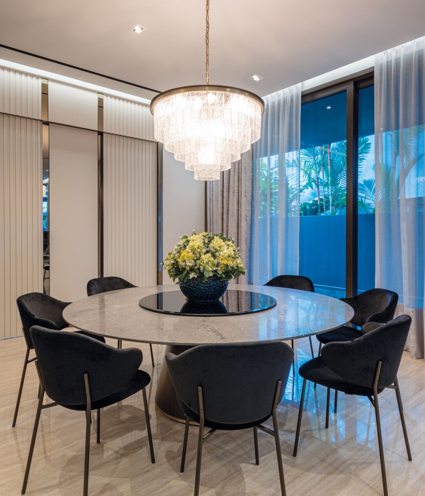The grand dining table and chandelier