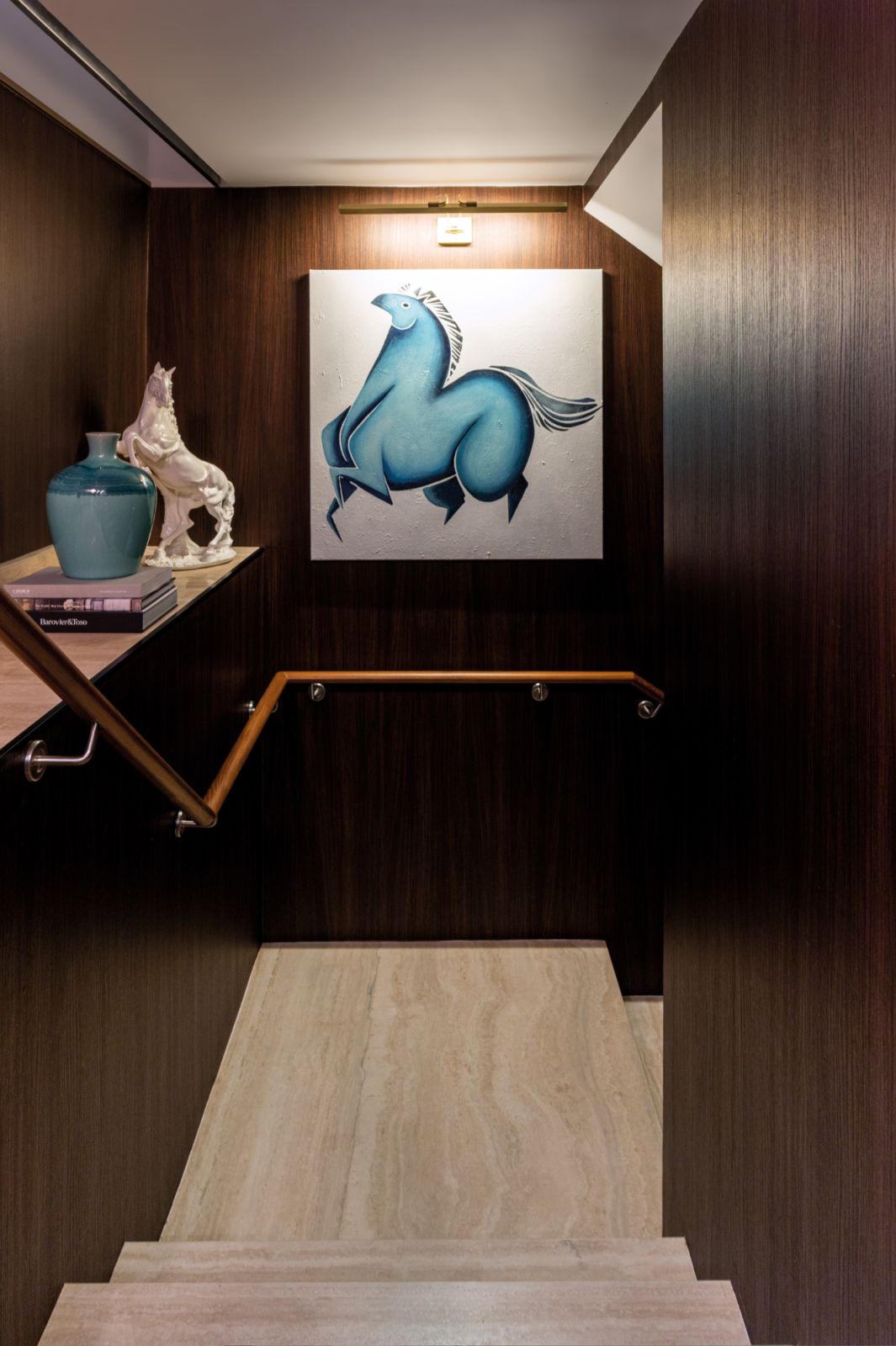 The intriguing hallway design that leads down to the basement