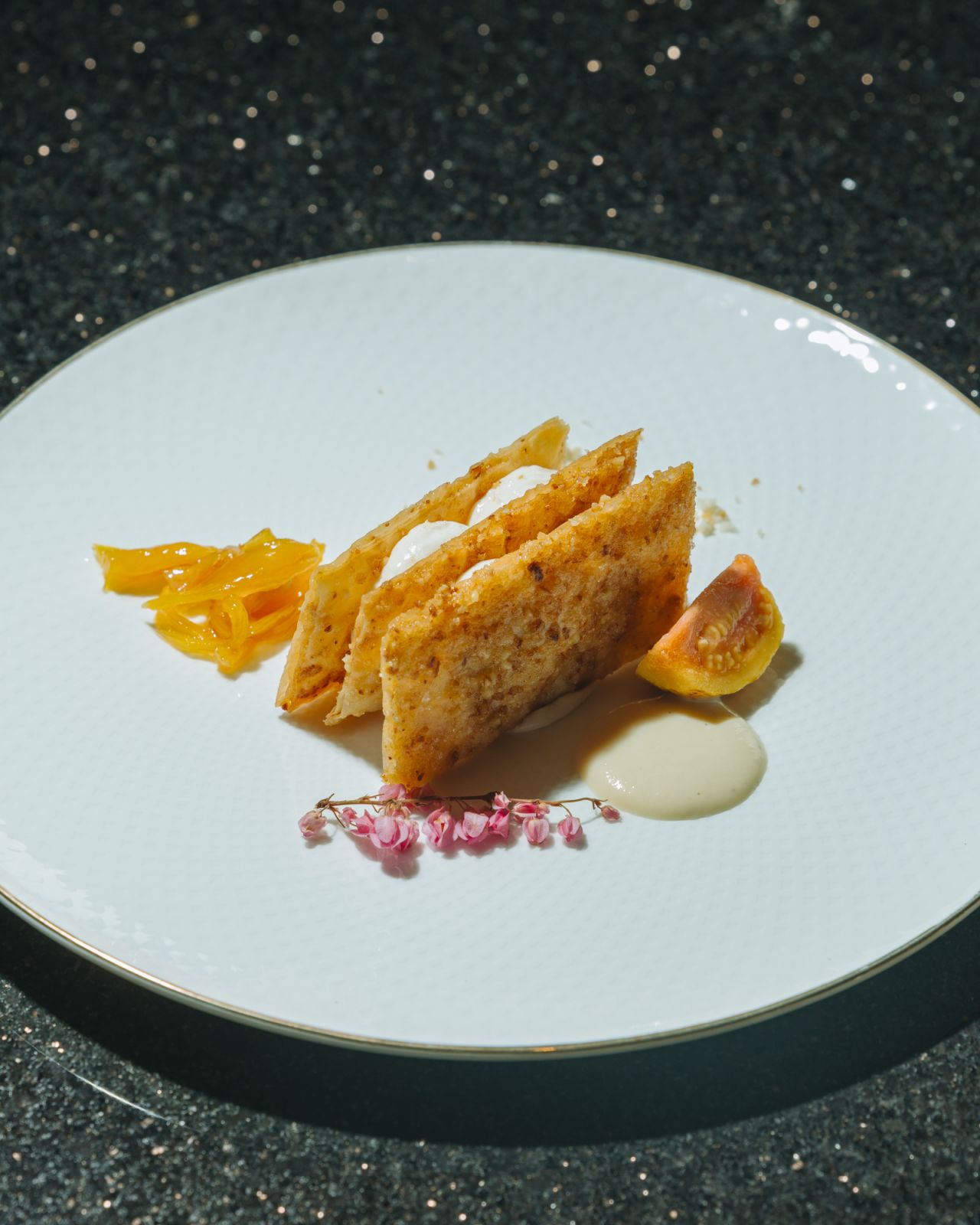 Pili-crusted hojaldres, smoked Laguna cheese foam, langka and pink guava, Philippine cinnamon and vanilla creme anglaise by Margarita Forés