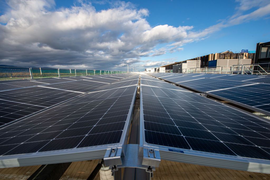 GENEVA, SWITZERLAND - NOVEMBER 18: General view of the solar panels on the East Wing building on November 18, 2022 in Geneva, Switzerland. Geneva's renovated airport terminal is powered by solar panels, geothermal power and smart glass. A new solar system has been installed on the roof of the airport's East Wing building. 6,700 m2 of photovoltaic panels are spread over the 520 metre length of the building. The 3,773 modules will produce 1.5 GWh of electricity per year, which will cover the building's consum