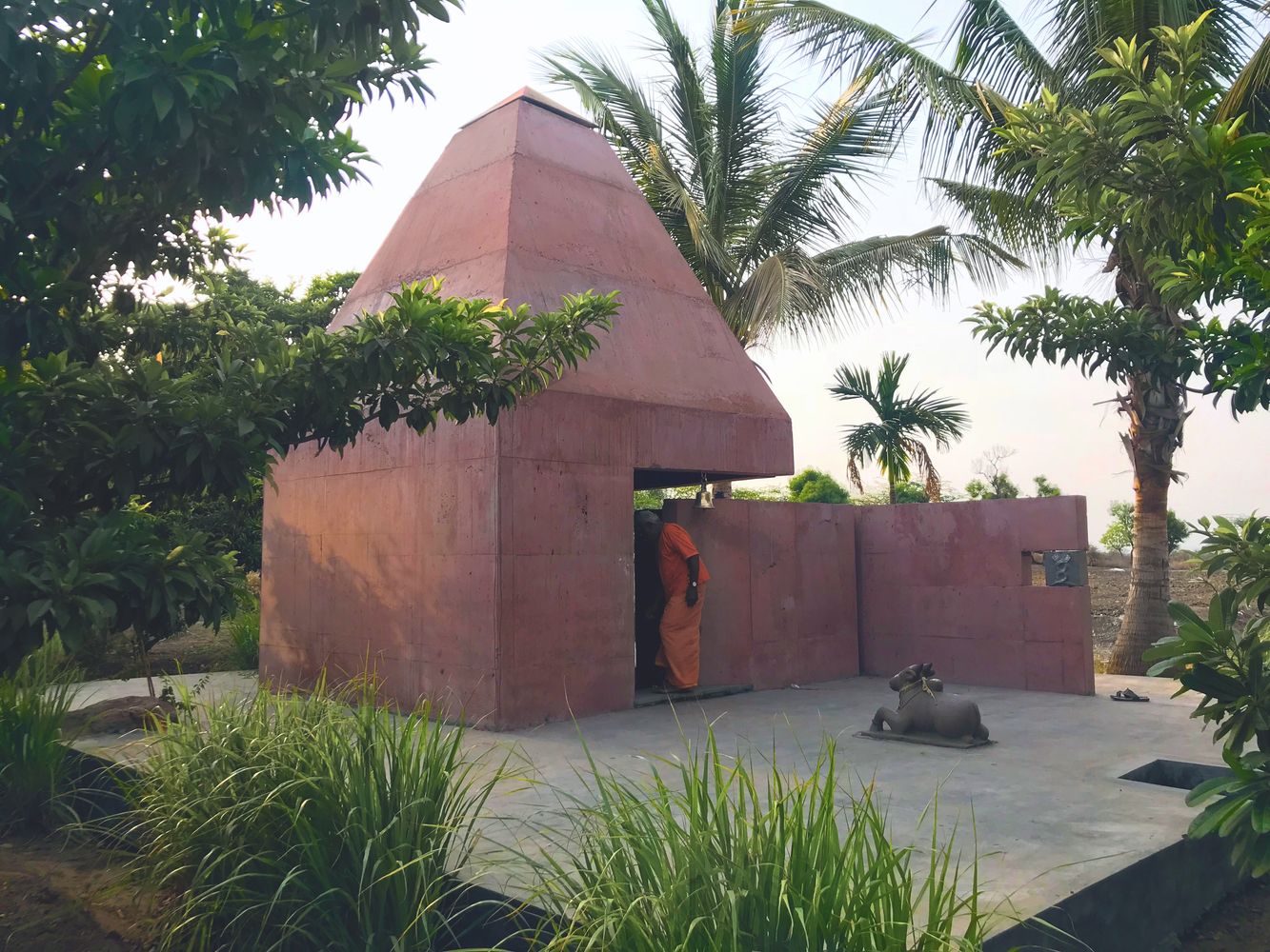 The structure rises from a square base to a triangular top with a cantilevered slit (Photo: Instagram / @atmosphere__space)