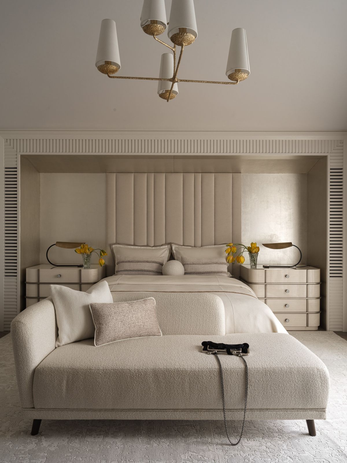 One of the bedrooms, which layers neutral tones in a compelling and textured manner