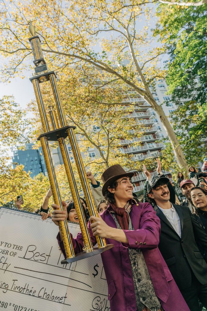 MANHATTAN, NY - Oactorber 27 : Miles Mitchell holds a trophy during a Timothee Chalamet lookalike contest in New York on Oct 27, 2024. (Photo by Jeenah Moon for The Washington Post via Getty Images)