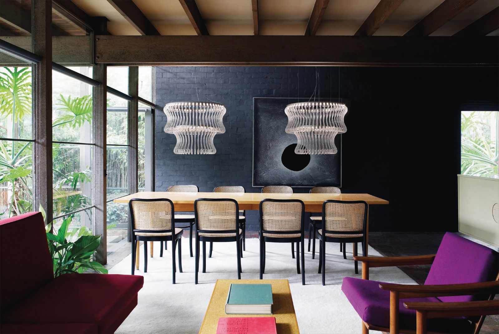 A pair of two-tiered Crown pendant lights lends sophistication to this dining room