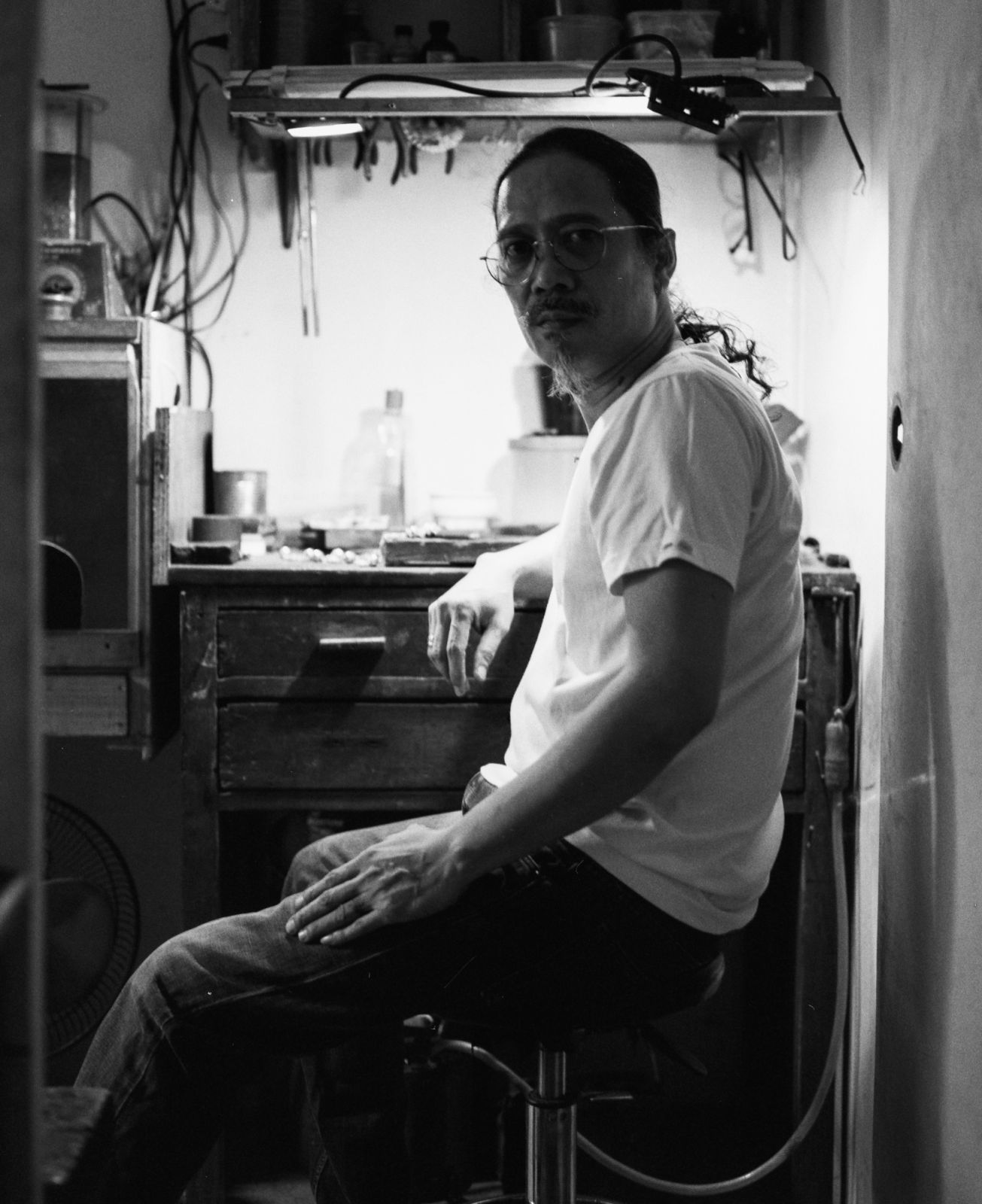 Oslog sits at his workshop (Photo: Karl King Aguña)