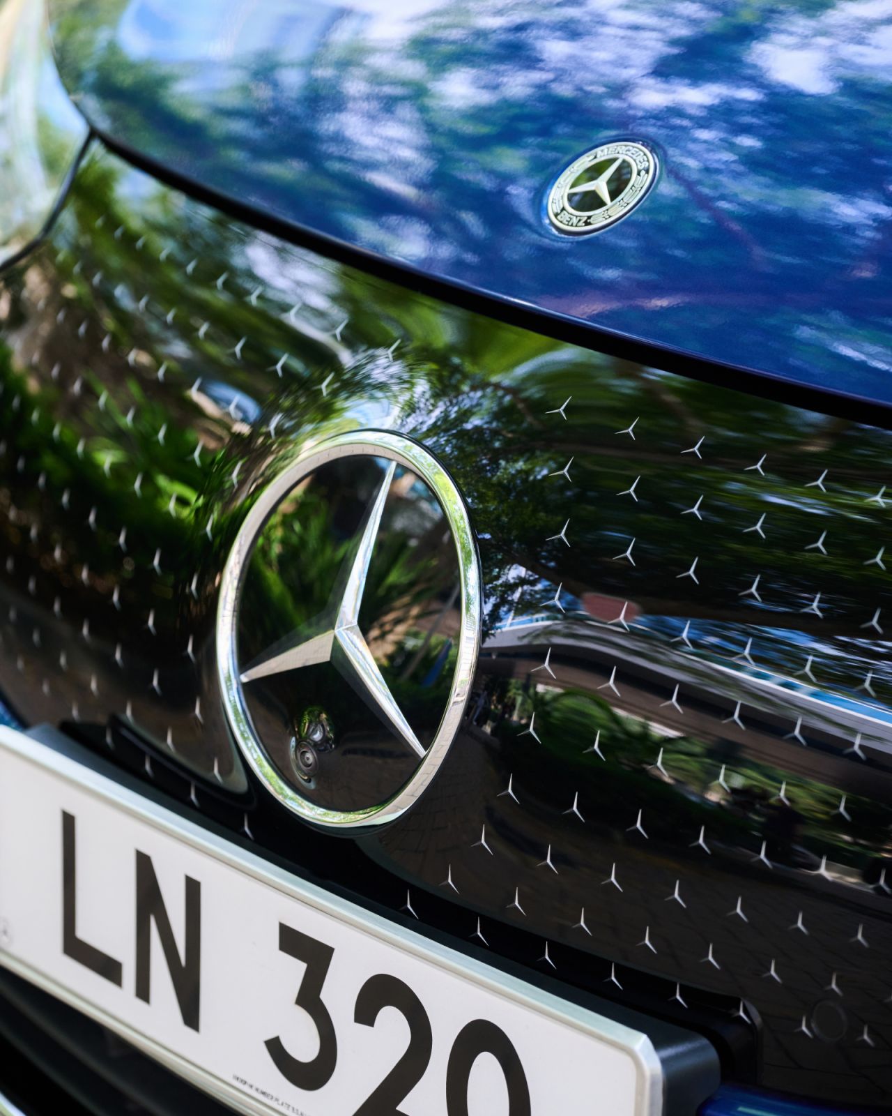 The black radiator grille of the Mercedes-Benz EQE is adorned with finely drawn Mercedes stars (Photo: Zed Leets/Tatler Hong Kong)