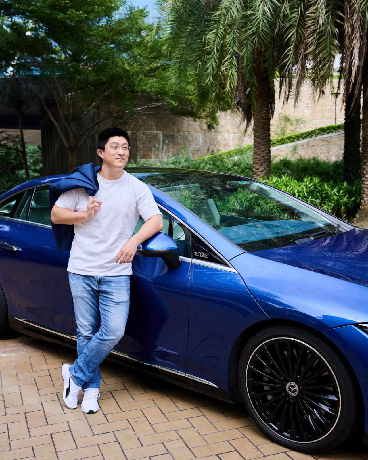 Wang stands next to the Mercedes-Benz EQE (Photo: Zed Leets/Tatler Hong Kong)
