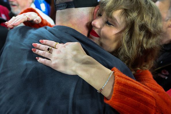BALTIMORE, MARYLAND - JANUARY 28: A detailed view of Taylor Swift's hand as she hugs Travis Kelce #87 of the Kansas City Chiefs after a 17-10 victory against the Baltimore Ravens in the AFC Championship Game at M&T Bank Stadium on January 28, 2024 in Baltimore, Maryland. (Photo by Rob Carr/Getty Images)