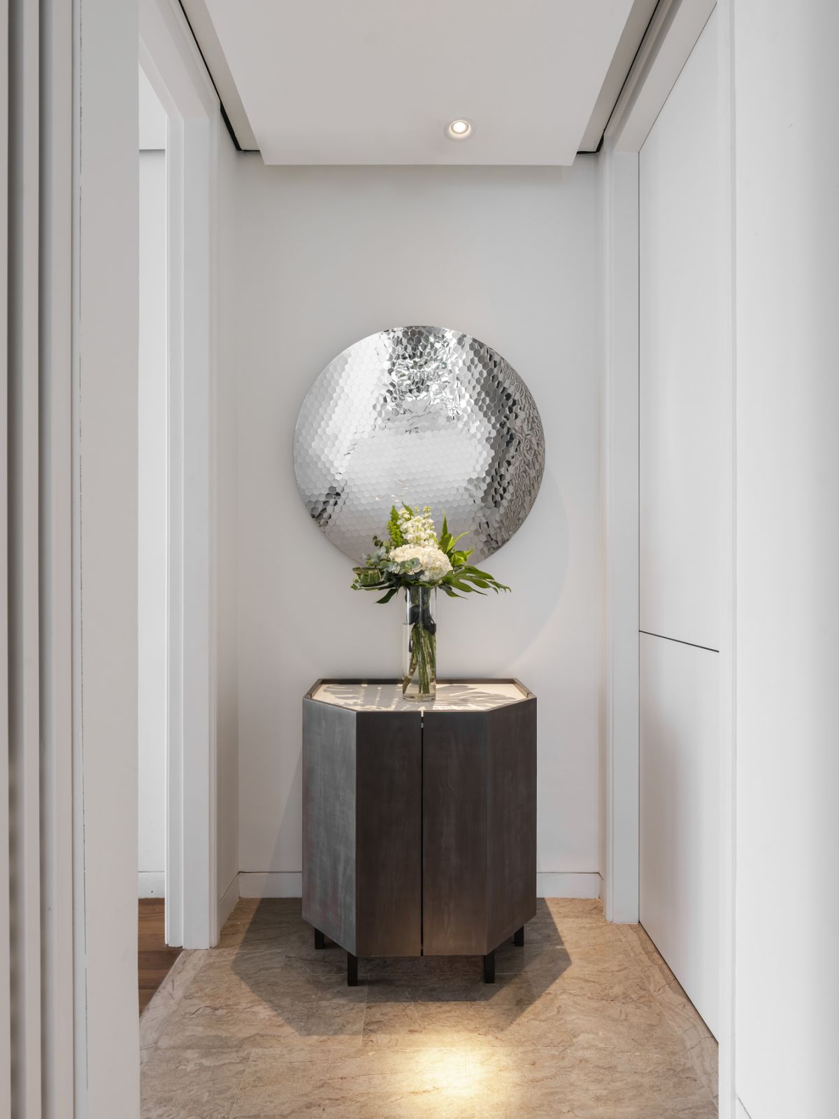 The foyer leading to the master bedroom is tastefully appointed