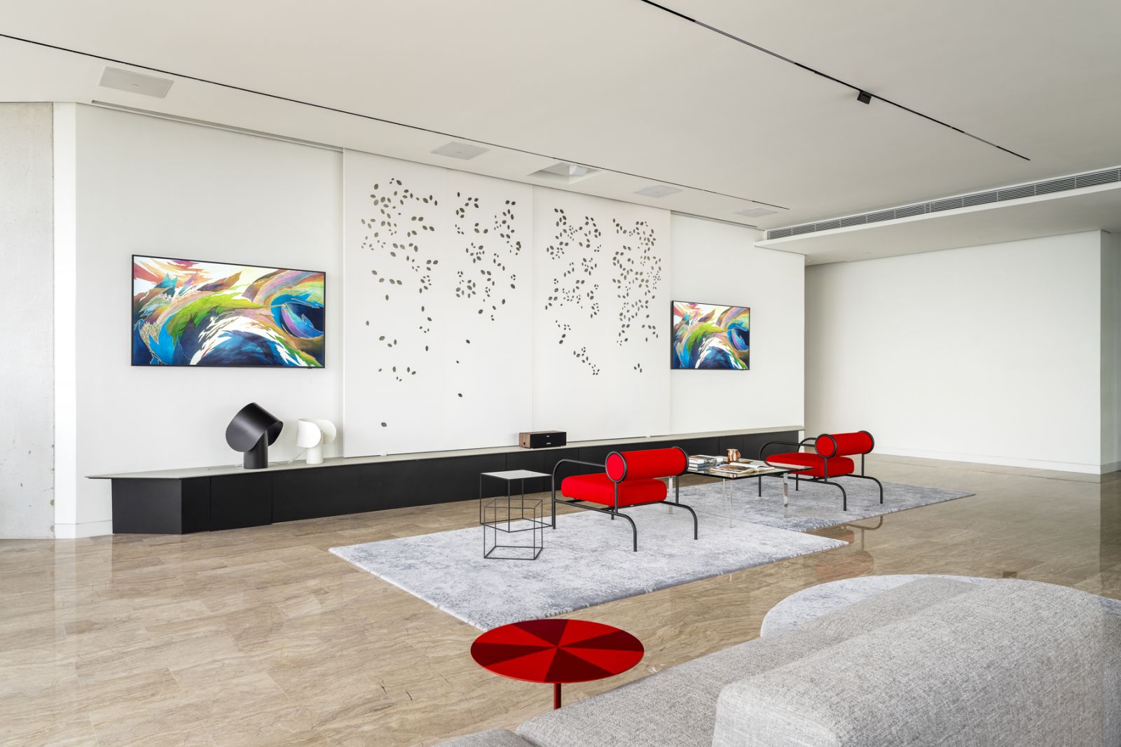 Iconic Capellini pieces like the red Sofa with Arms armchair by Shiro Kuramata was curated for the gallery-like living space